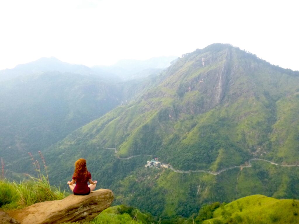 A tourist enjoying the breath taking view of little adams preak, ella, sri lanka